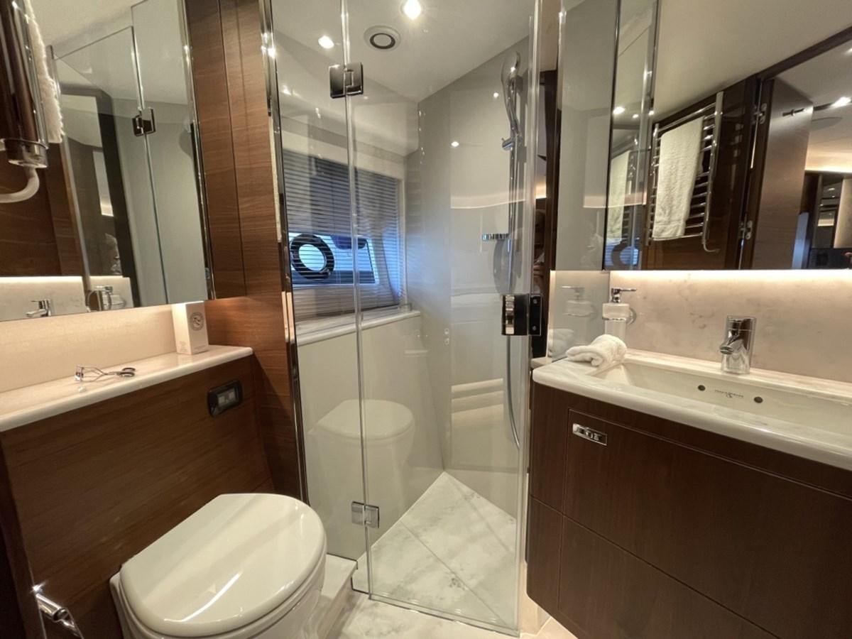 a bathroom with a glass shower aboard PRINCESS S78 Yacht for Sale