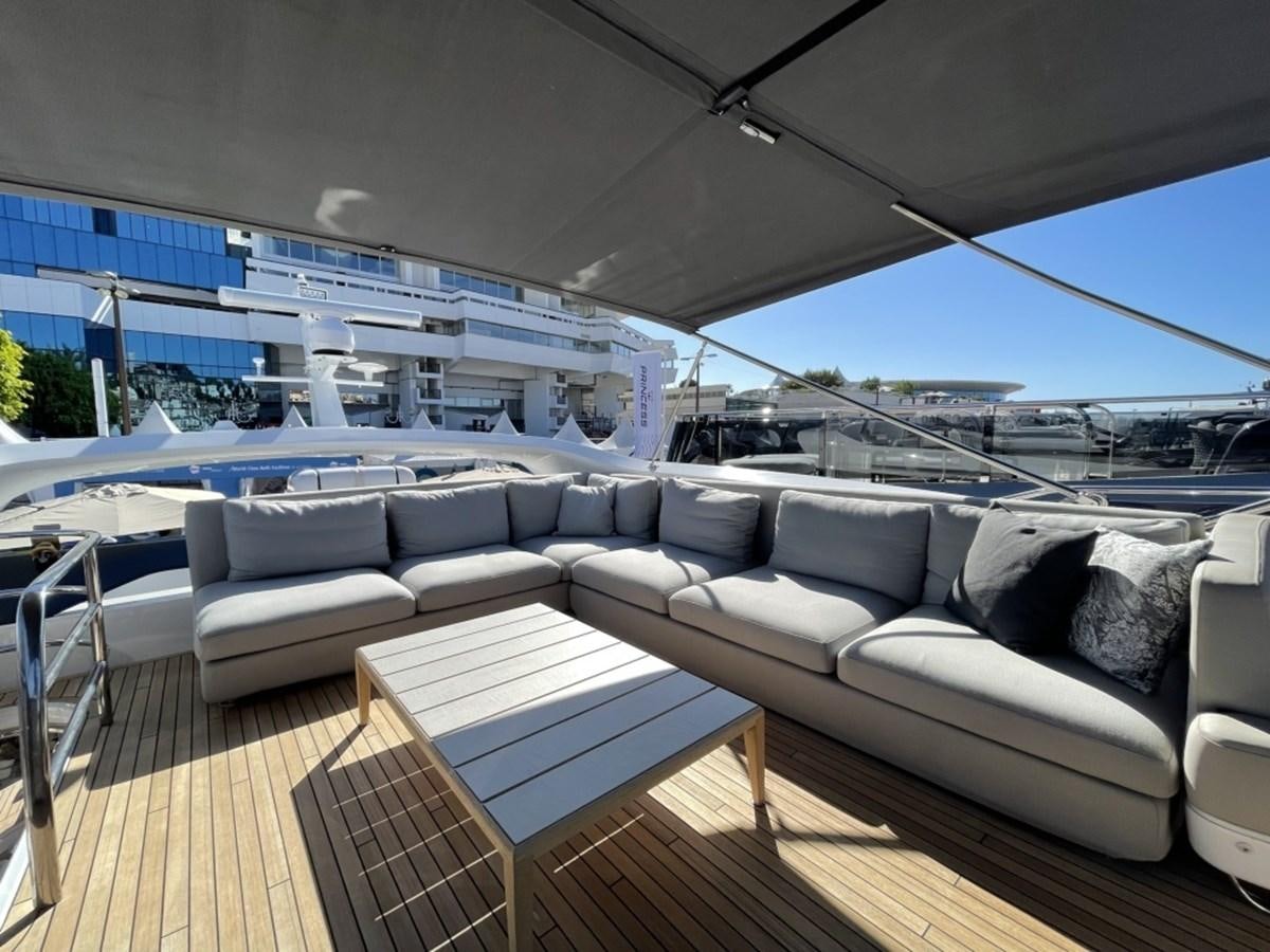 a large living room with a large balcony aboard PRINCESS S78 Yacht for Sale