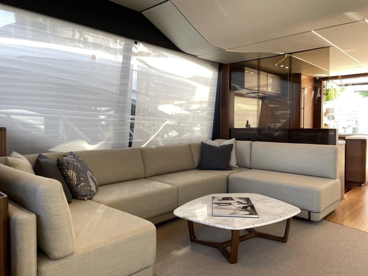 a living room with a large window aboard PRINCESS S78 Yacht for Sale