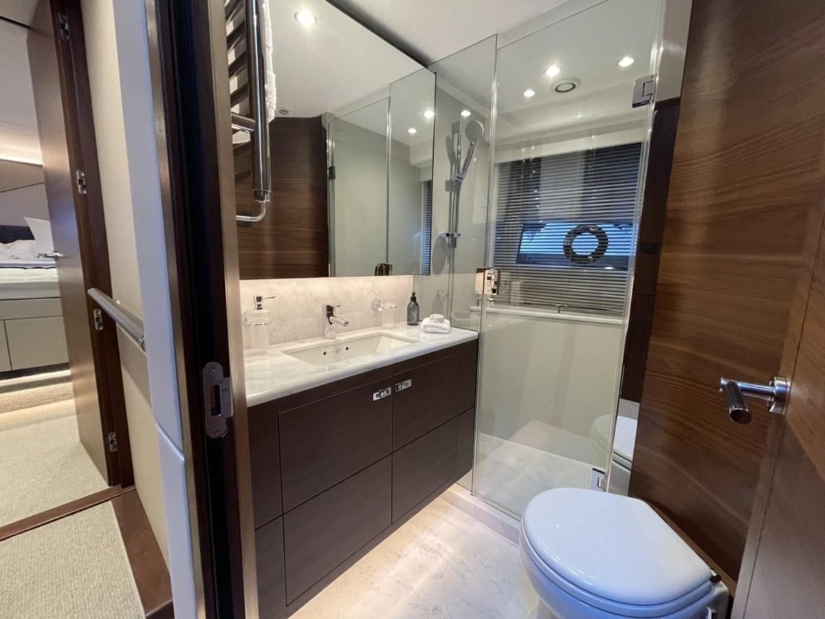 a bathroom with a large mirror aboard PRINCESS S78 Yacht for Sale