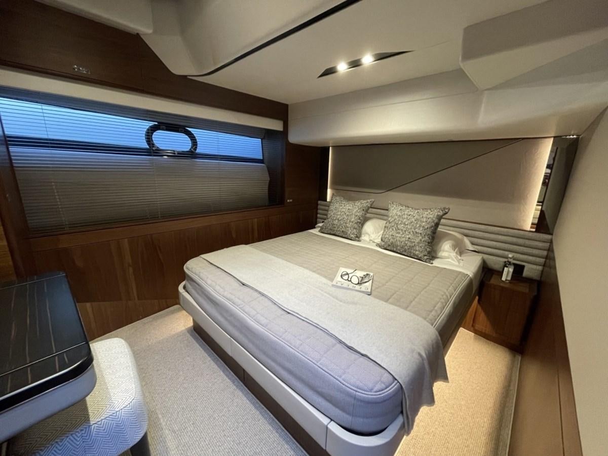 a room with a bed and a television aboard PRINCESS S78 Yacht for Sale