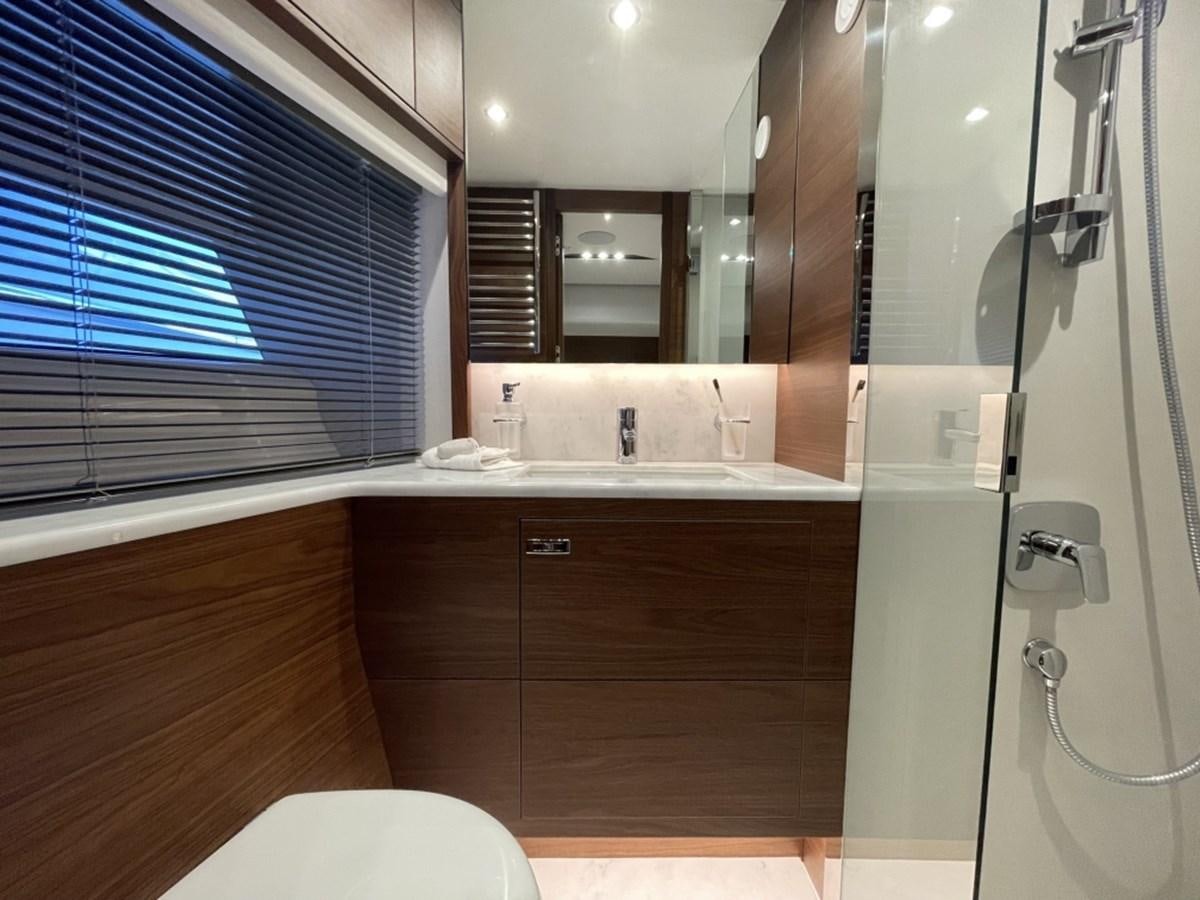 a bathroom with a glass shower aboard PRINCESS S78 Yacht for Sale