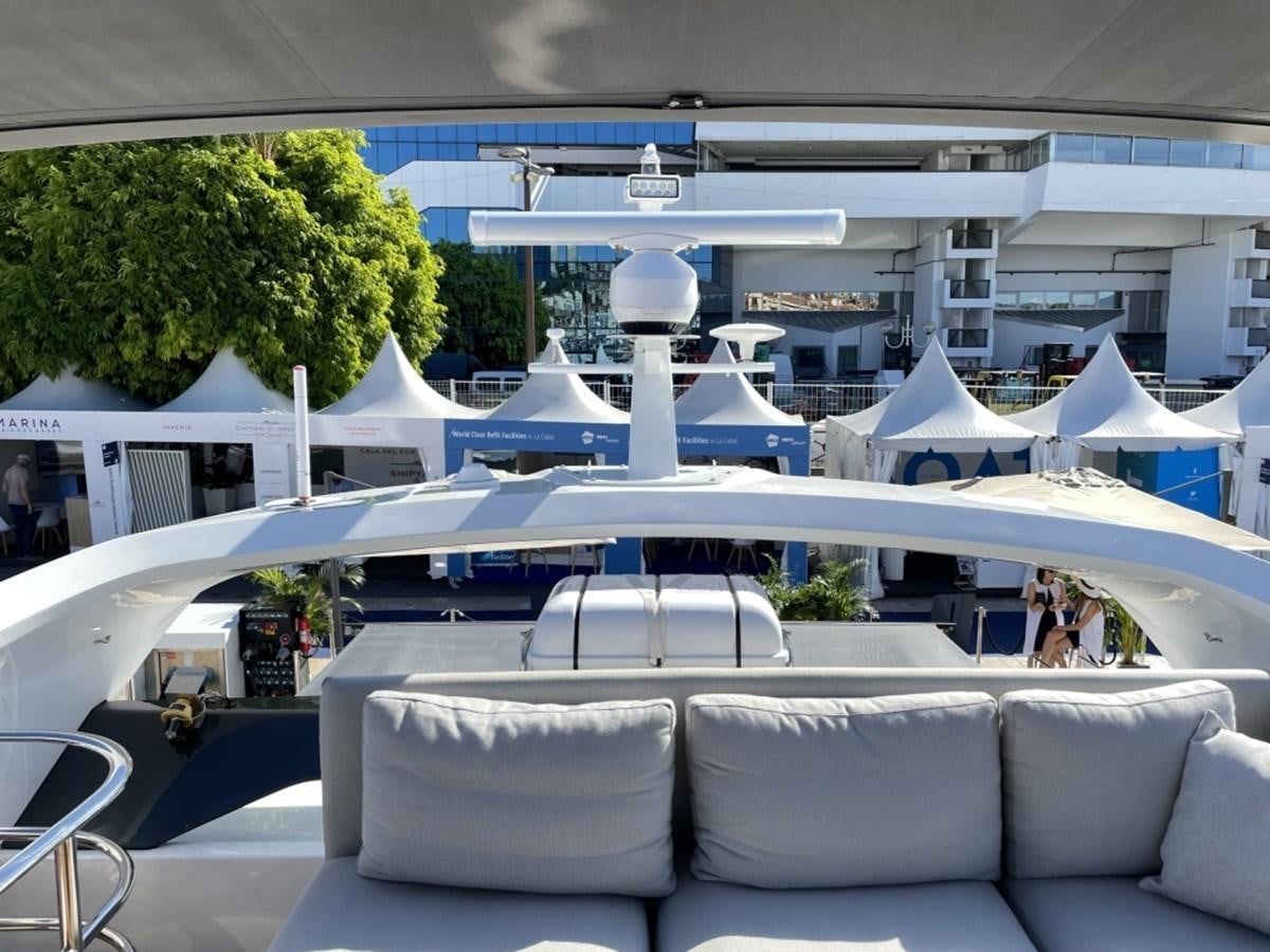 a large white tent with a group of people sitting on it aboard PRINCESS S78 Yacht for Sale