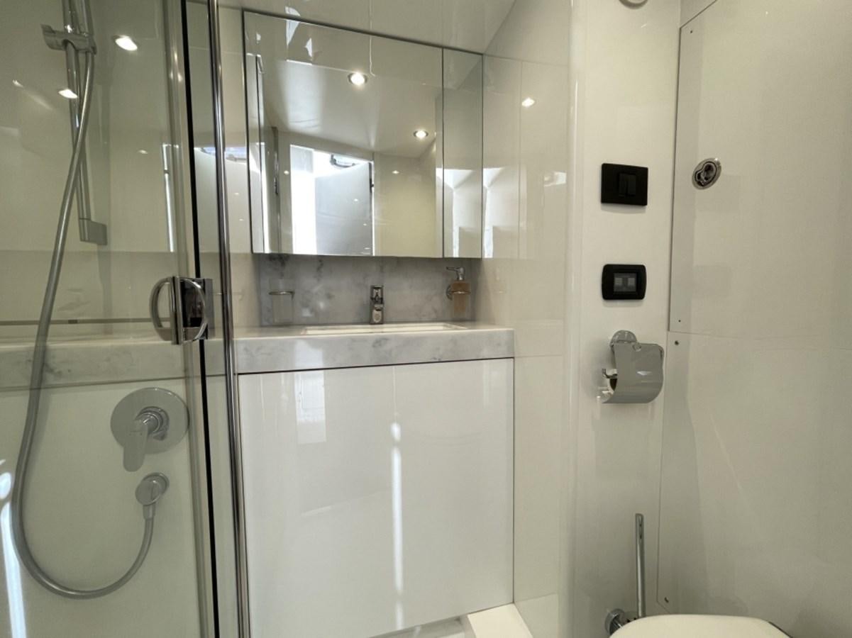 a bathroom with a glass shower aboard PRINCESS S78 Yacht for Sale