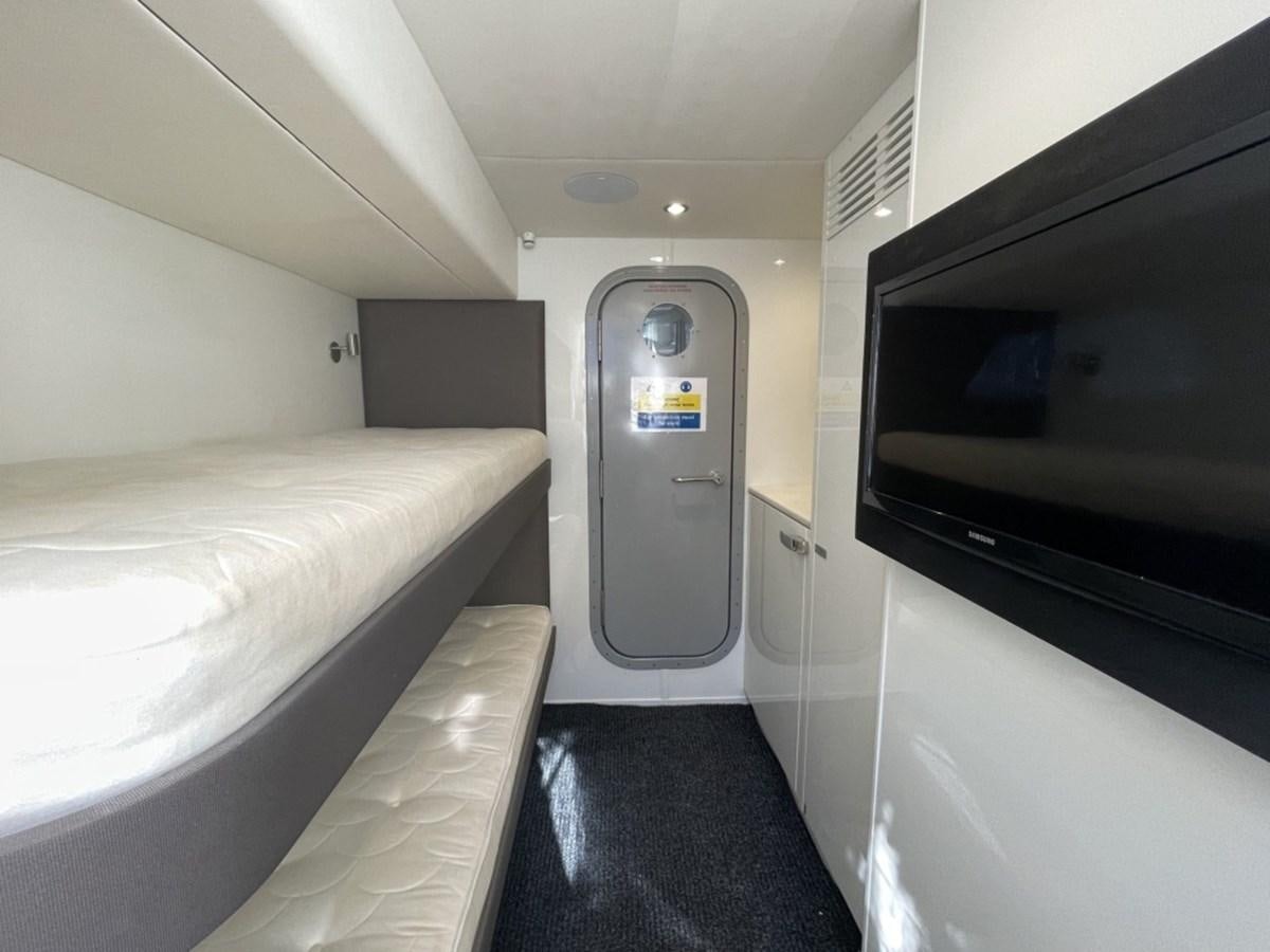 a room with a bed and a door aboard PRINCESS S78 Yacht for Sale