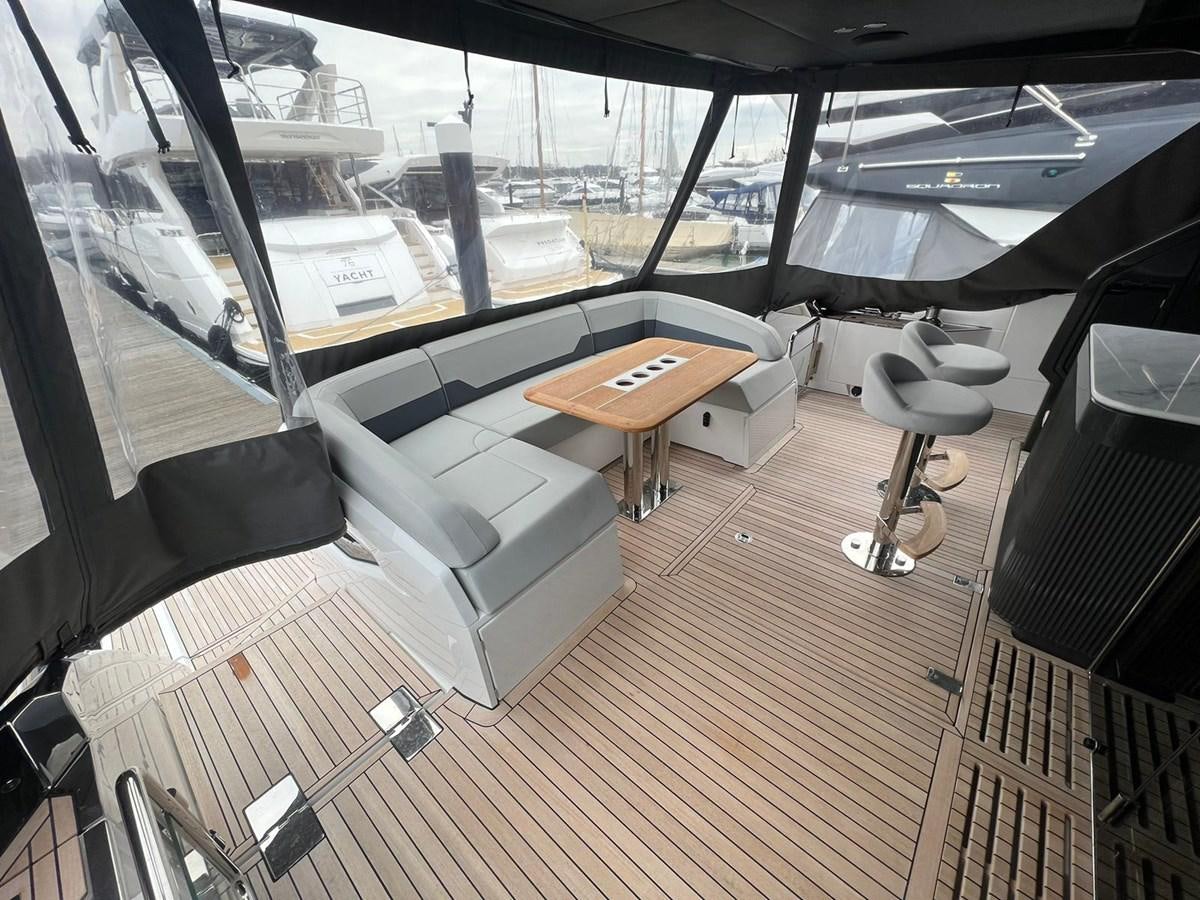 a room with a table and chairs aboard SQUADRON 68 Yacht for Sale