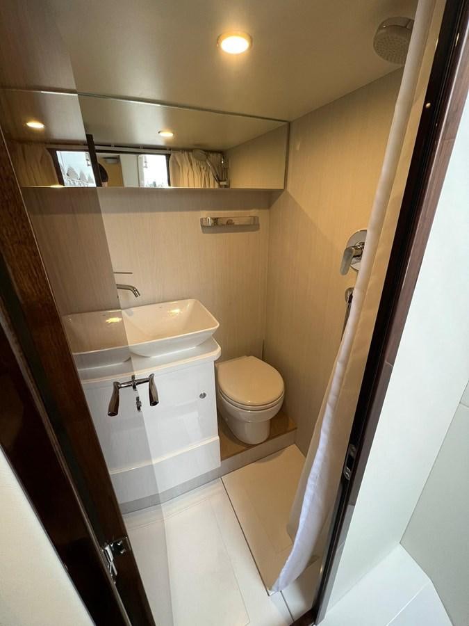 a bathroom with a sink and toilet aboard SQUADRON 68 Yacht for Sale