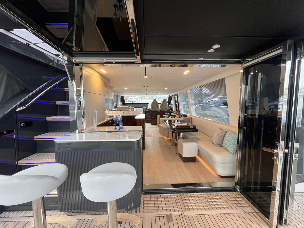 a room with a table and chairs aboard SQUADRON 68 Yacht for Sale