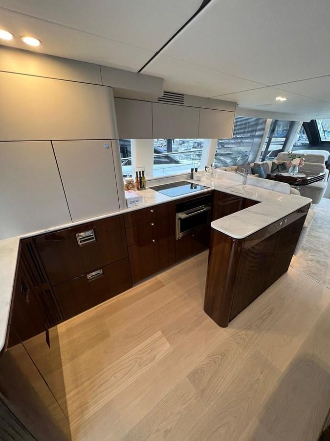 a kitchen with a large island aboard SQUADRON 68 Yacht for Sale