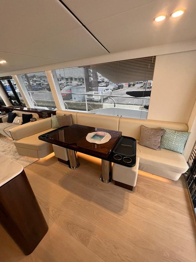 a living room with a large window aboard SQUADRON 68 Yacht for Sale