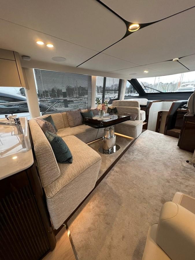 a living room with a couch and a table aboard SQUADRON 68 Yacht for Sale