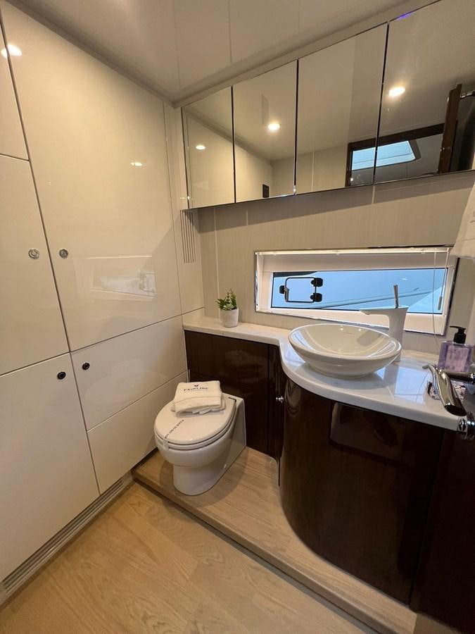 a bathroom with a sink and a toilet aboard SQUADRON 68 Yacht for Sale