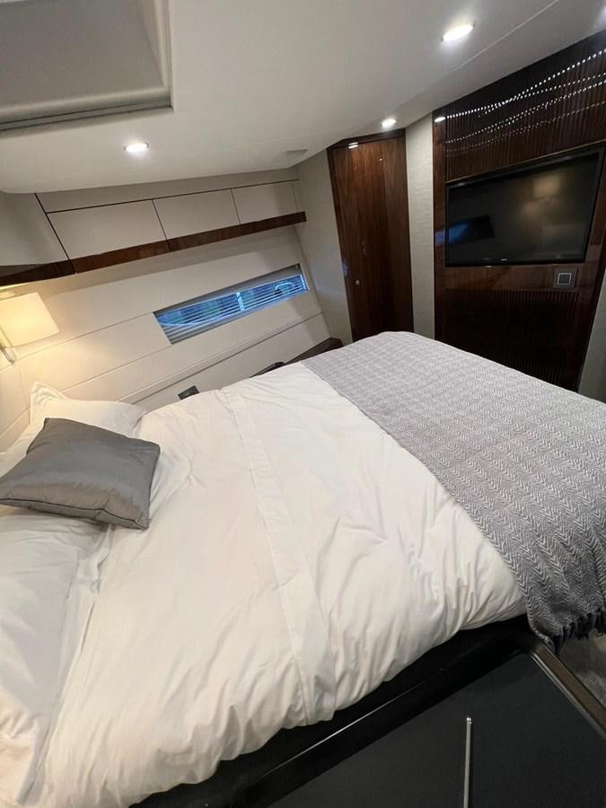 a bed with a white comforter aboard SQUADRON 68 Yacht for Sale