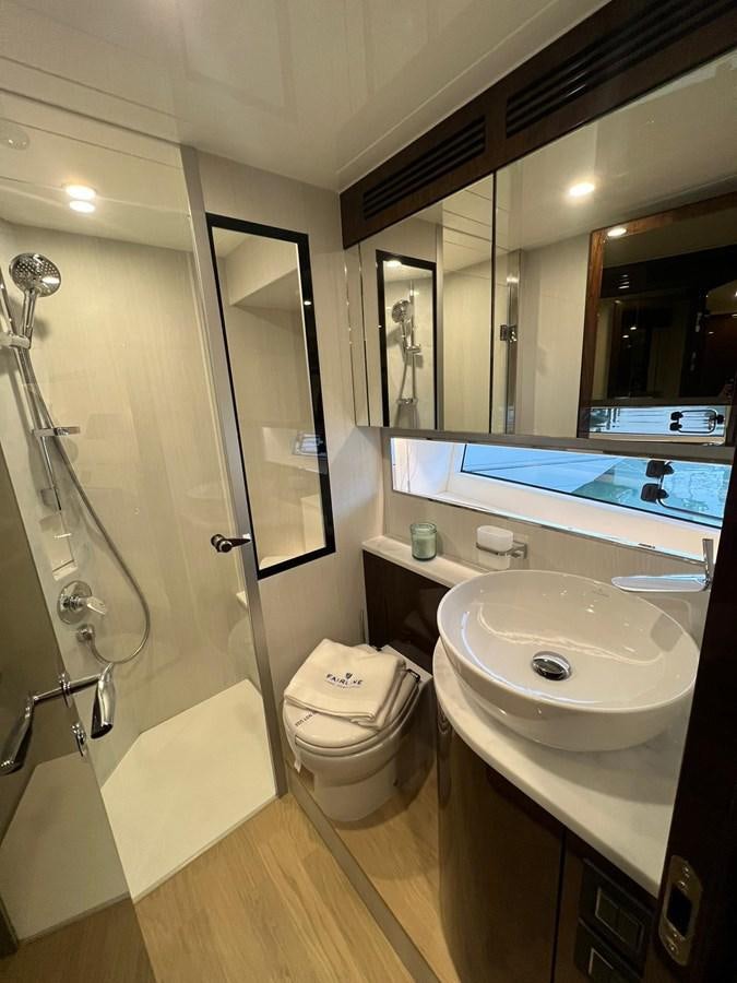 a bathroom with a glass shower aboard SQUADRON 68 Yacht for Sale