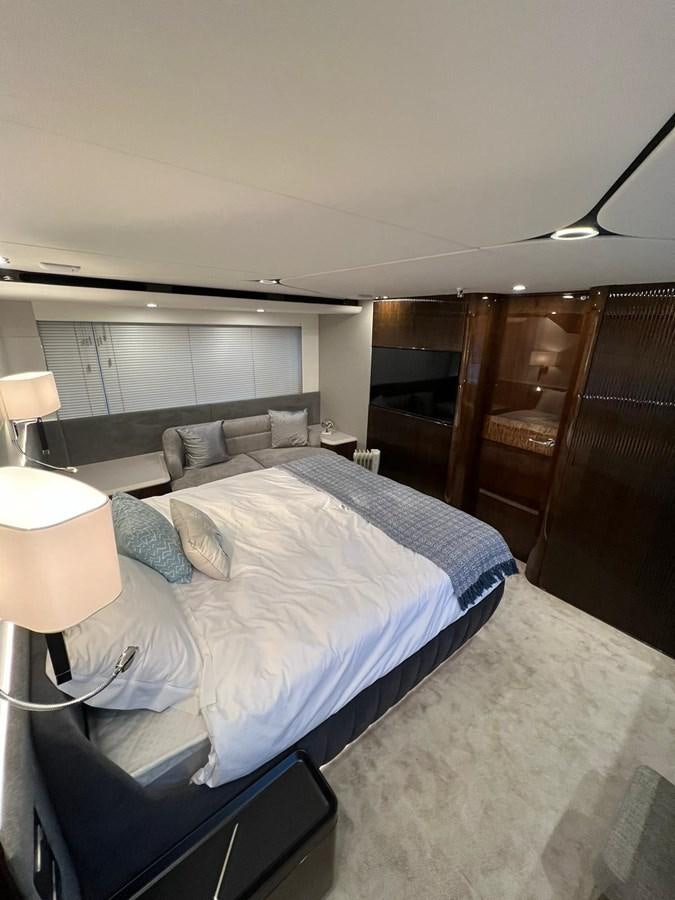 a room with a bed and a wood door aboard SQUADRON 68 Yacht for Sale