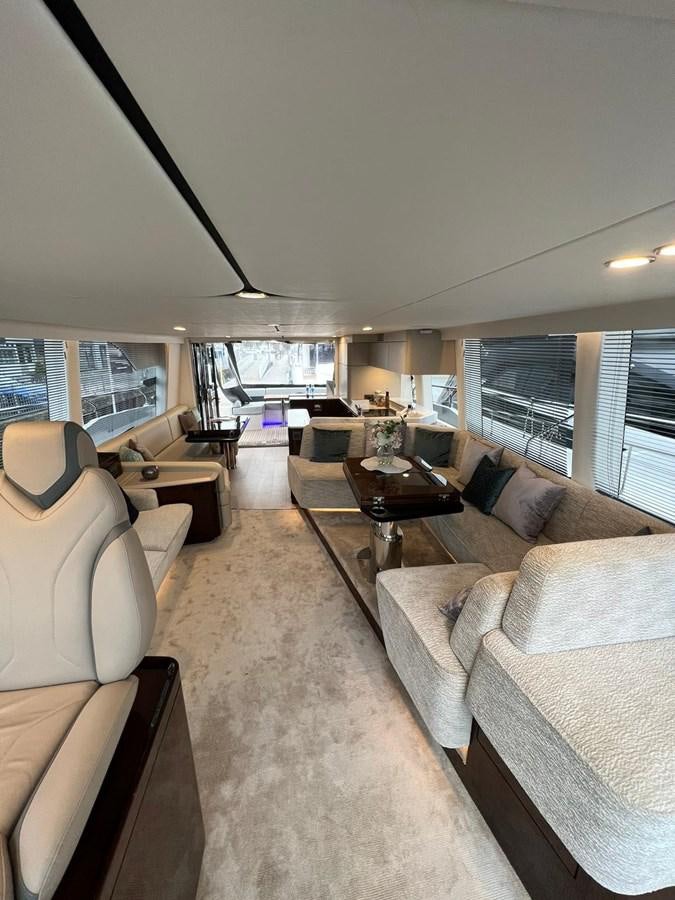 a living room with a large window aboard SQUADRON 68 Yacht for Sale