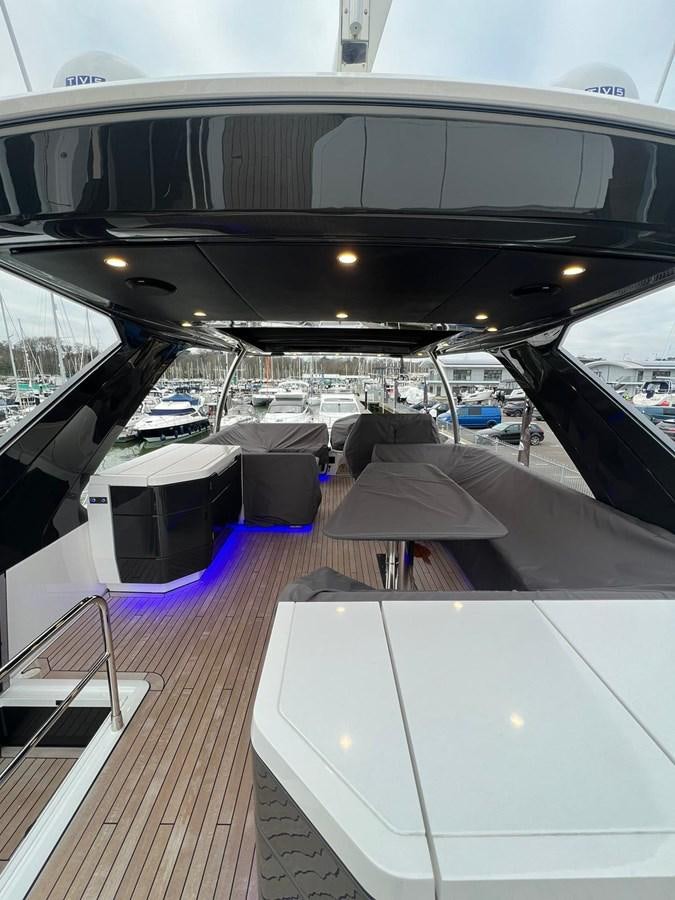 a large room with tables and chairs aboard SQUADRON 68 Yacht for Sale