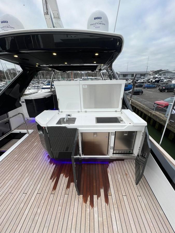 a table on a deck aboard SQUADRON 68 Yacht for Sale