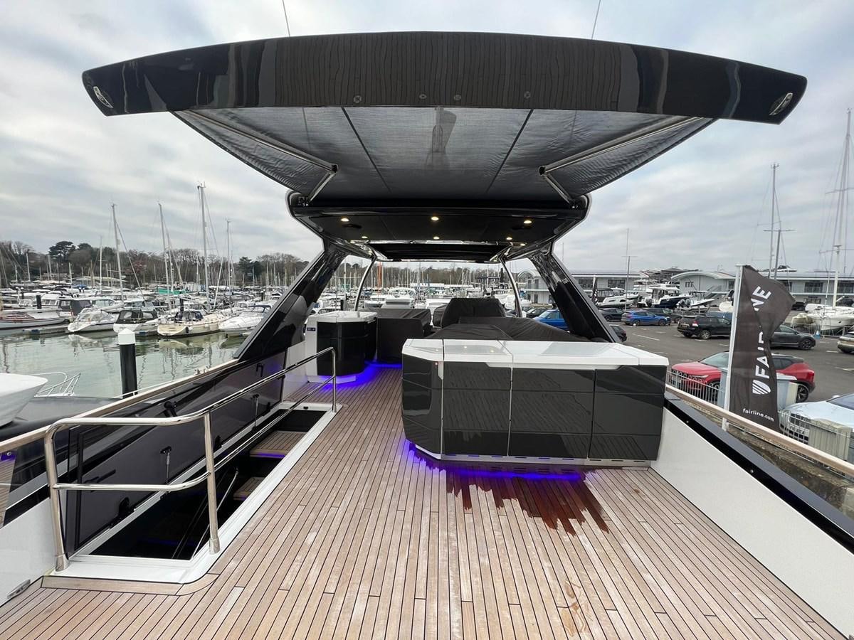a deck with a building and a body of water aboard SQUADRON 68 Yacht for Sale