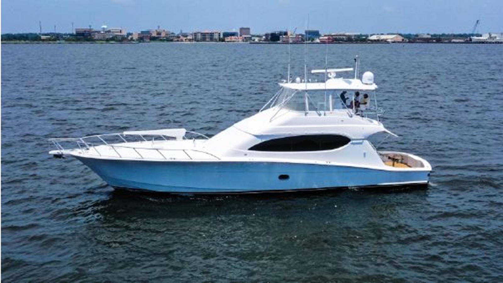 a white boat in the water aboard 2007 68 HATTERAS CONVERTIBLE Yacht for Sale
