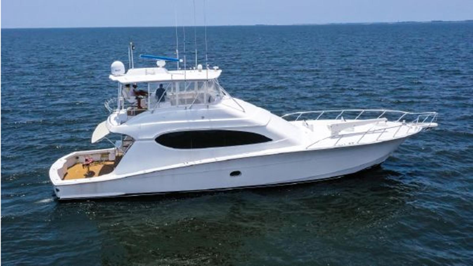 a white yacht in the ocean aboard 2007 68 HATTERAS CONVERTIBLE Yacht for Sale