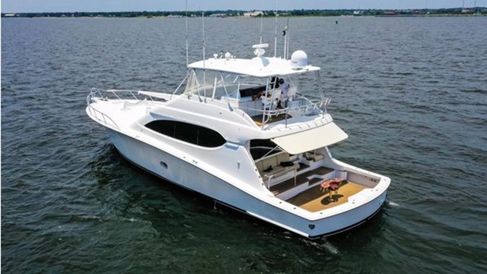 a white yacht in the water aboard 2007 68 HATTERAS CONVERTIBLE Yacht for Sale