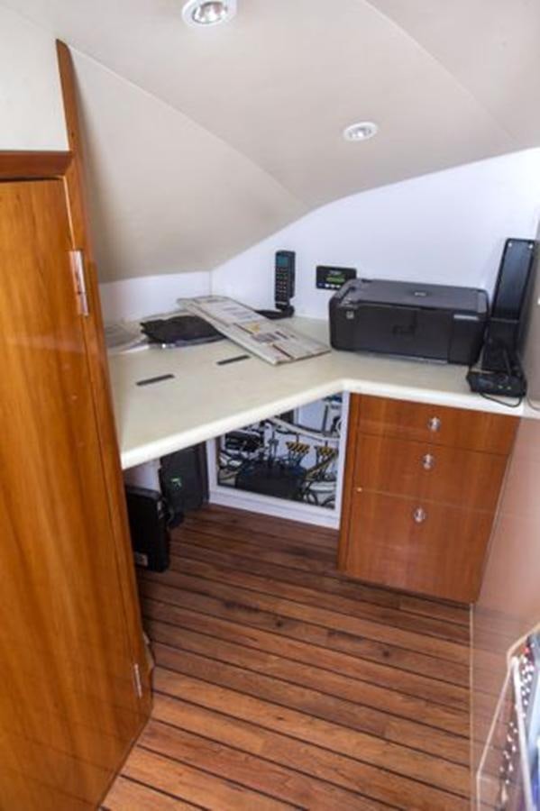 a desk with a printer and a printer on it aboard 2007 68 HATTERAS CONVERTIBLE Yacht for Sale