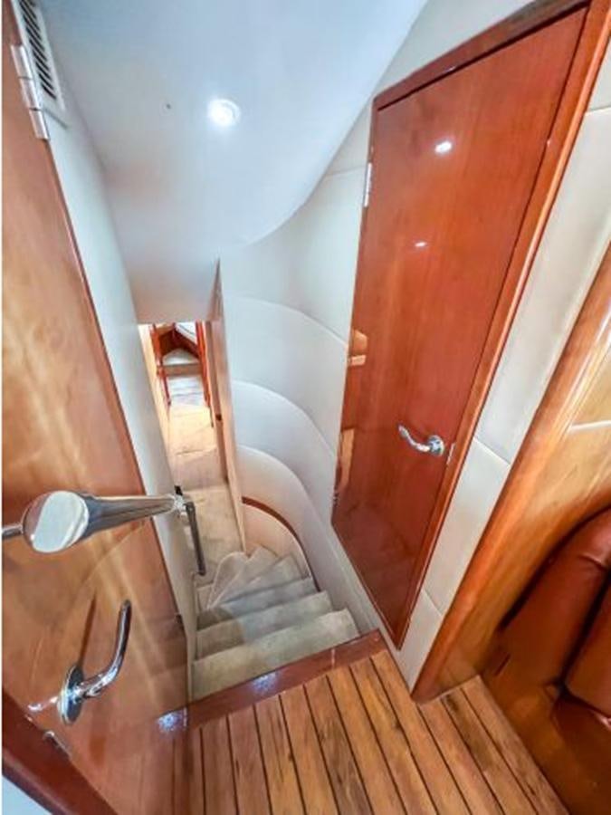 a door with a handle aboard 2007 68 HATTERAS CONVERTIBLE Yacht for Sale