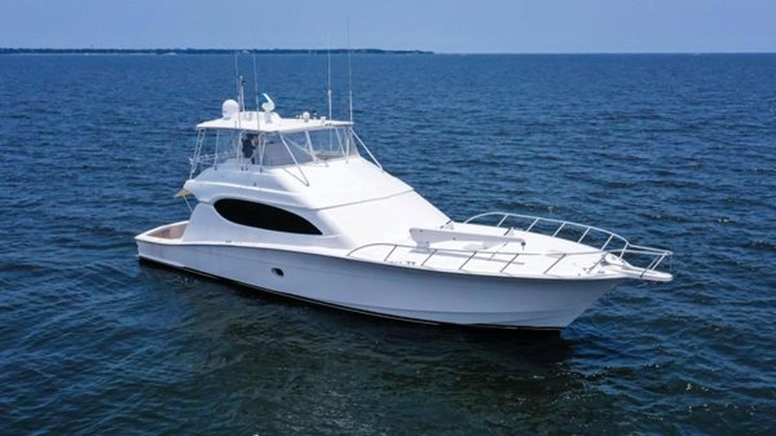 a white yacht in the water aboard 2007 68 HATTERAS CONVERTIBLE Yacht for Sale