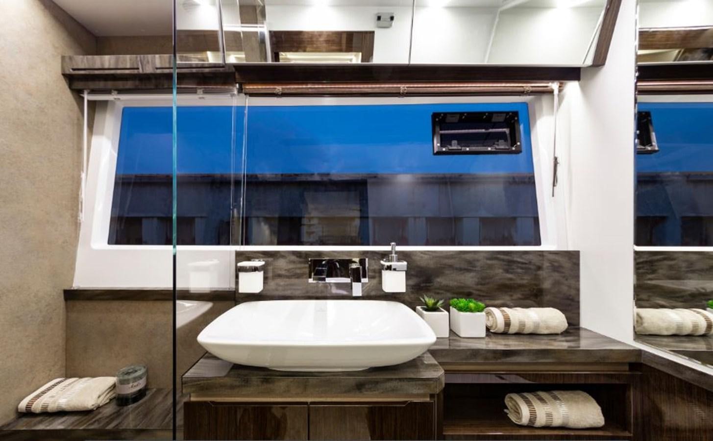 a bathroom with a large mirror aboard GALEON 640 Yacht for Sale