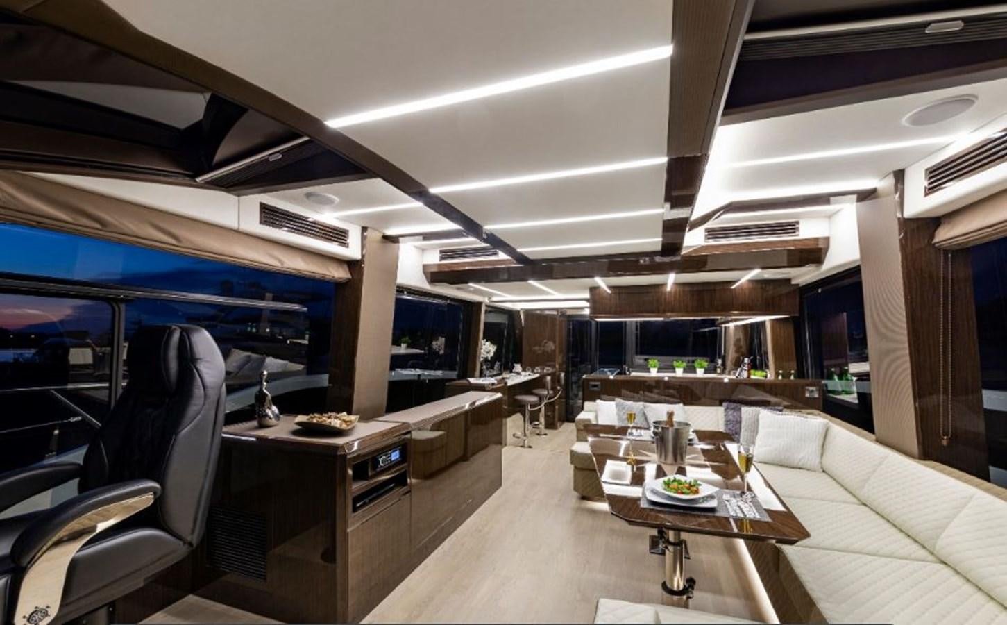 a room with a large table and chairs aboard GALEON 640 Yacht for Sale