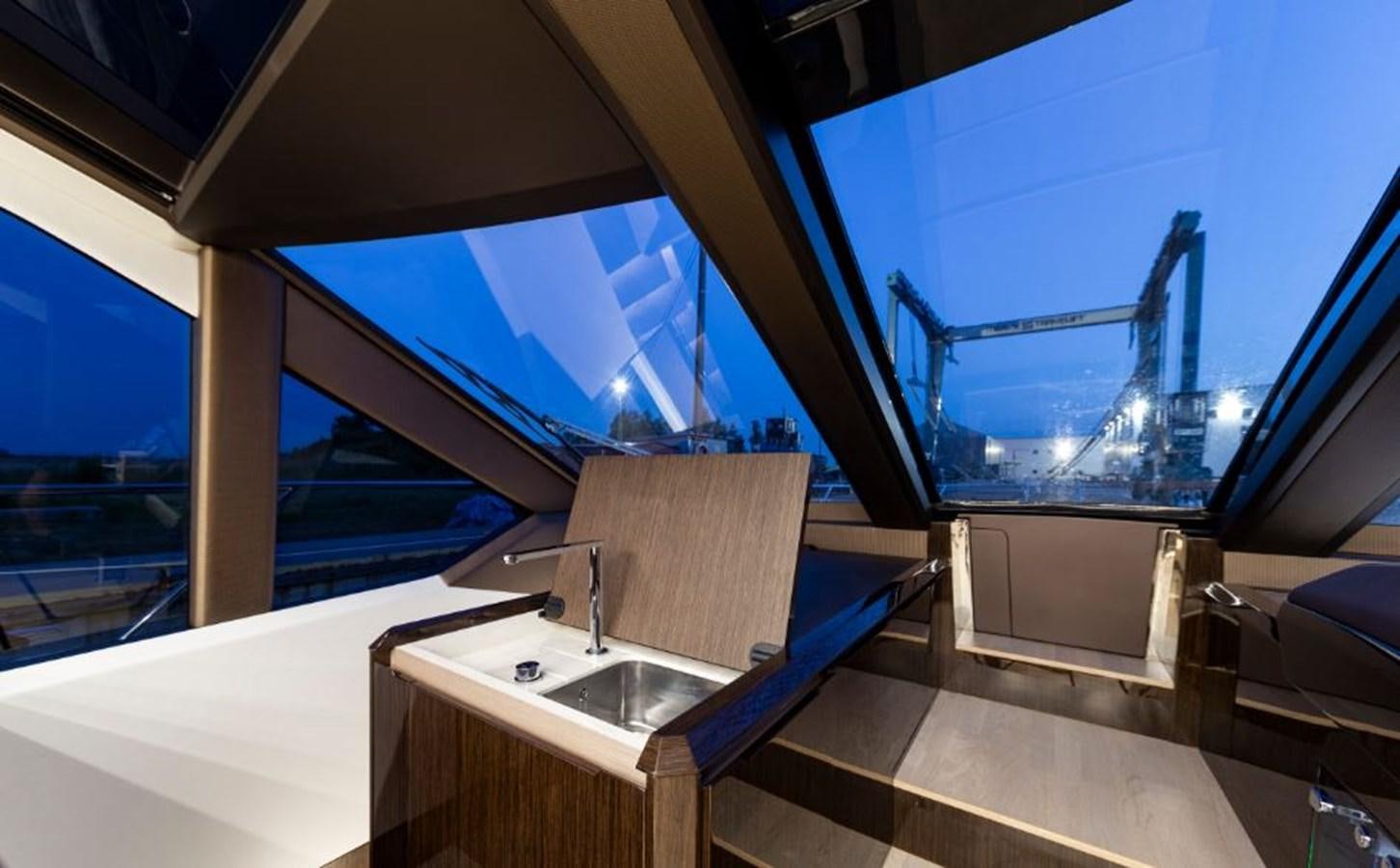 a bathroom with a sink and a large window aboard GALEON 640 Yacht for Sale