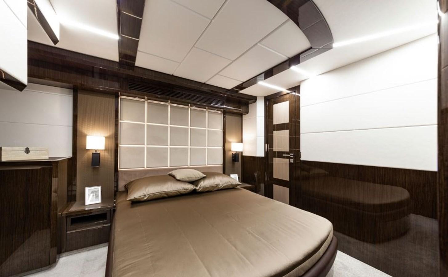 a room with a bed and a lamp aboard GALEON 640 Yacht for Sale