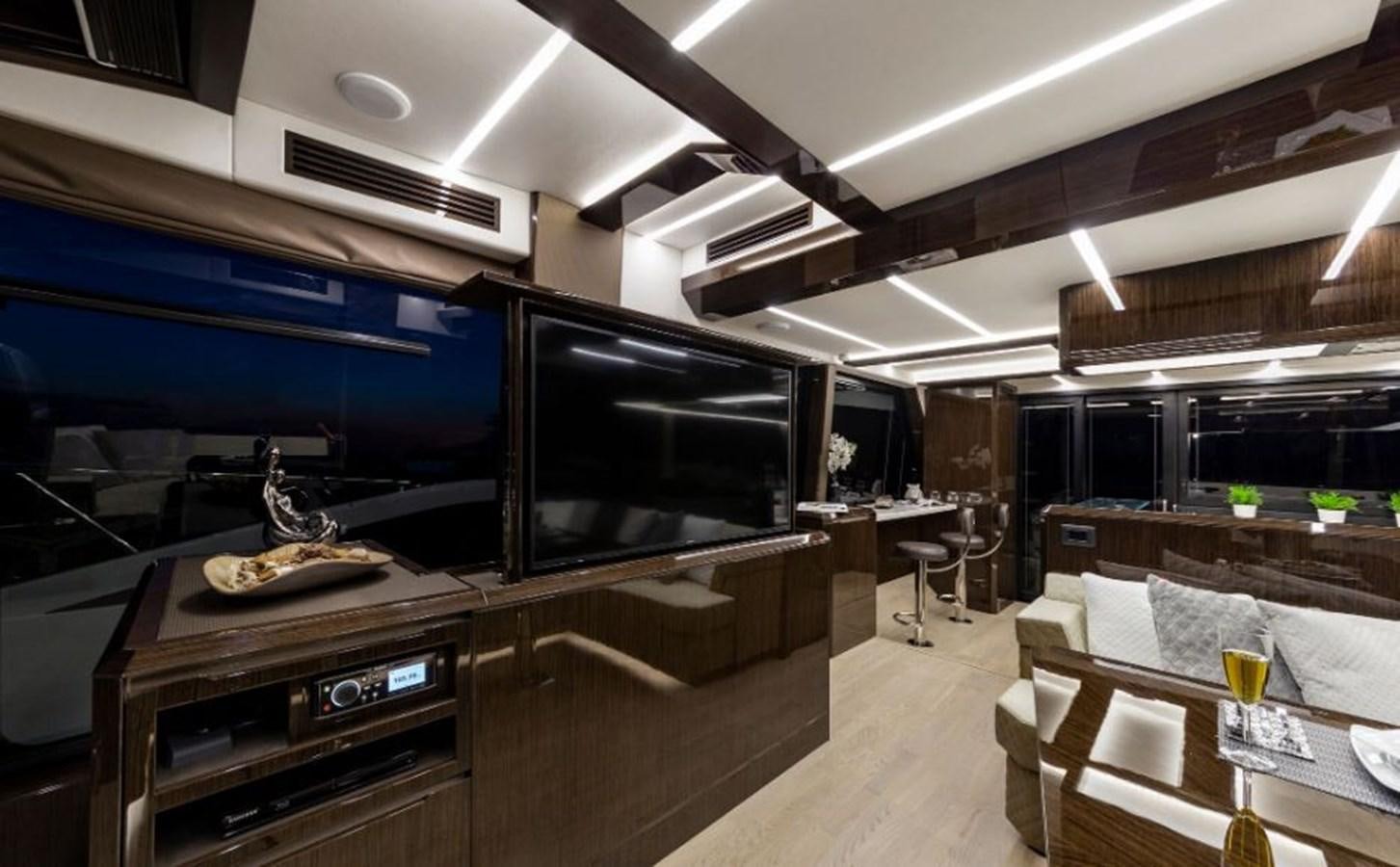 a kitchen with a bar and a table aboard GALEON 640 Yacht for Sale