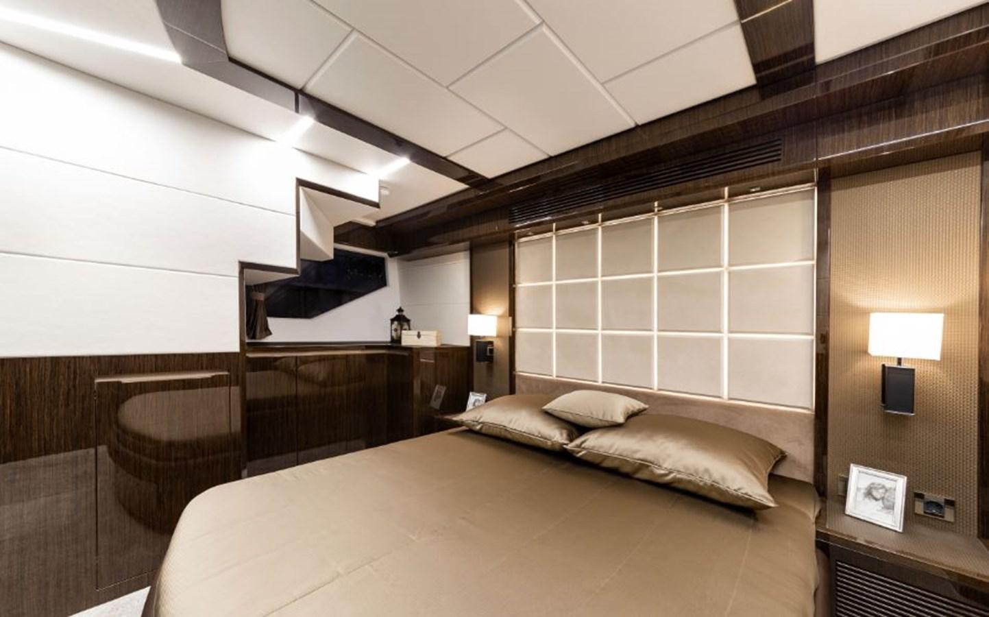 a room with a bed and a table aboard GALEON 640 Yacht for Sale