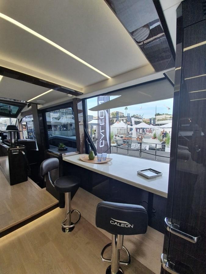 a room with a table and chairs aboard GALEON 640 Yacht for Sale