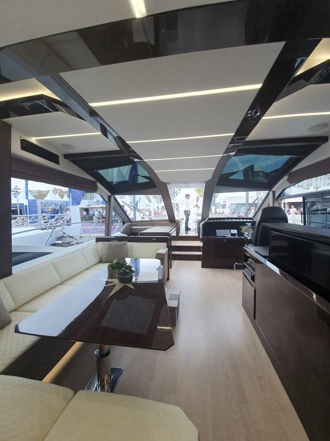 a room with a table and chairs aboard GALEON 640 Yacht for Sale
