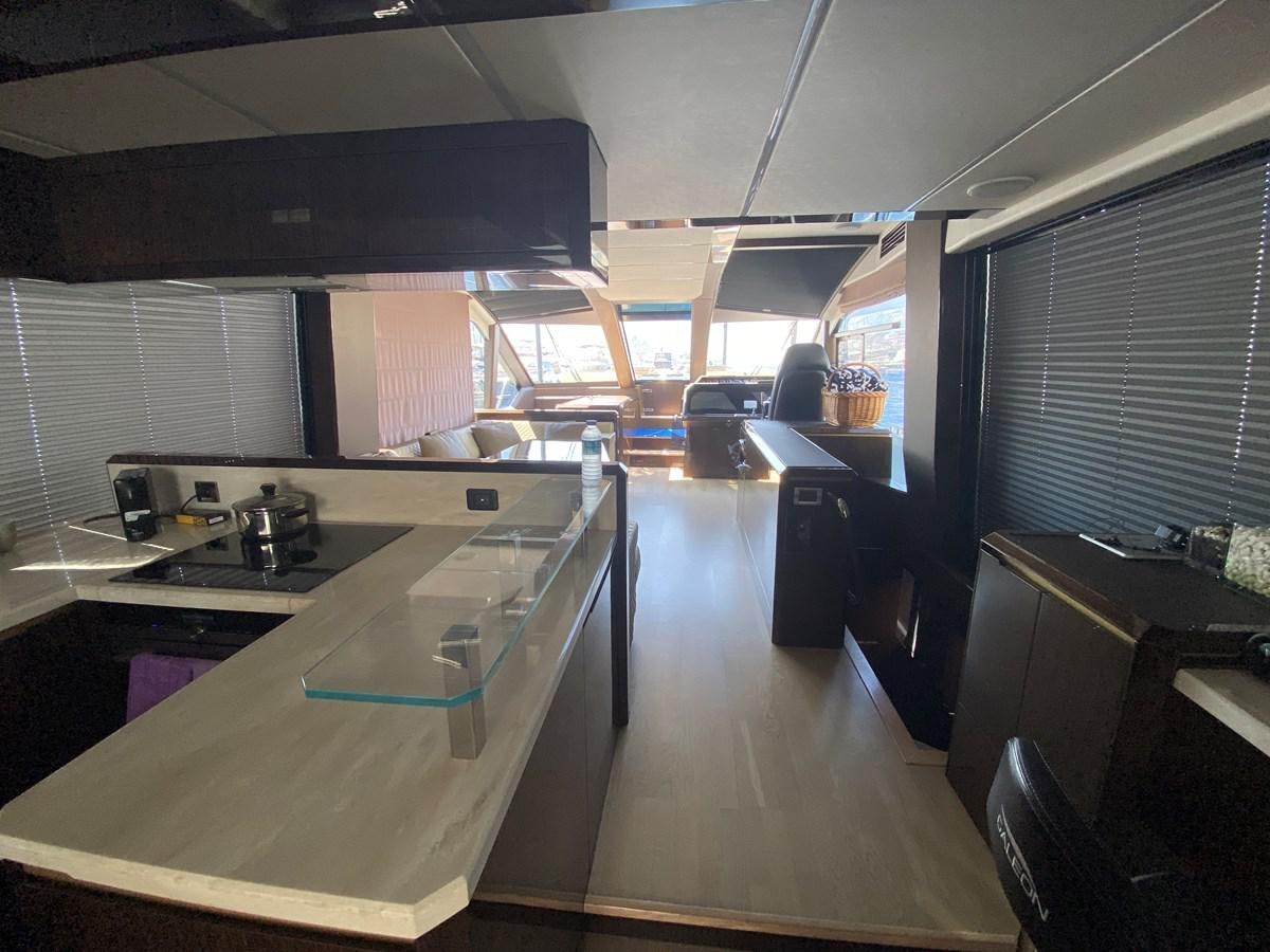 a kitchen with a large island aboard GALEON 640 Yacht for Sale