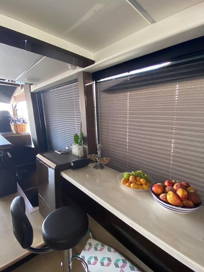 a table with a bowl of fruit on it aboard GALEON 640 Yacht for Sale