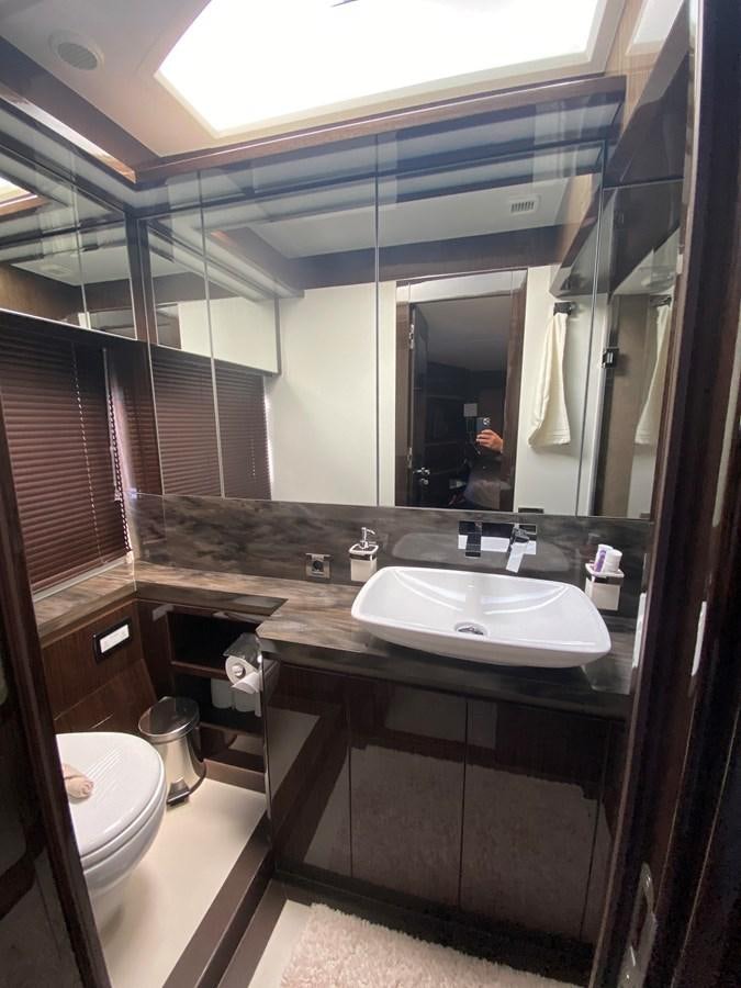 a bathroom with a large mirror aboard GALEON 640 Yacht for Sale