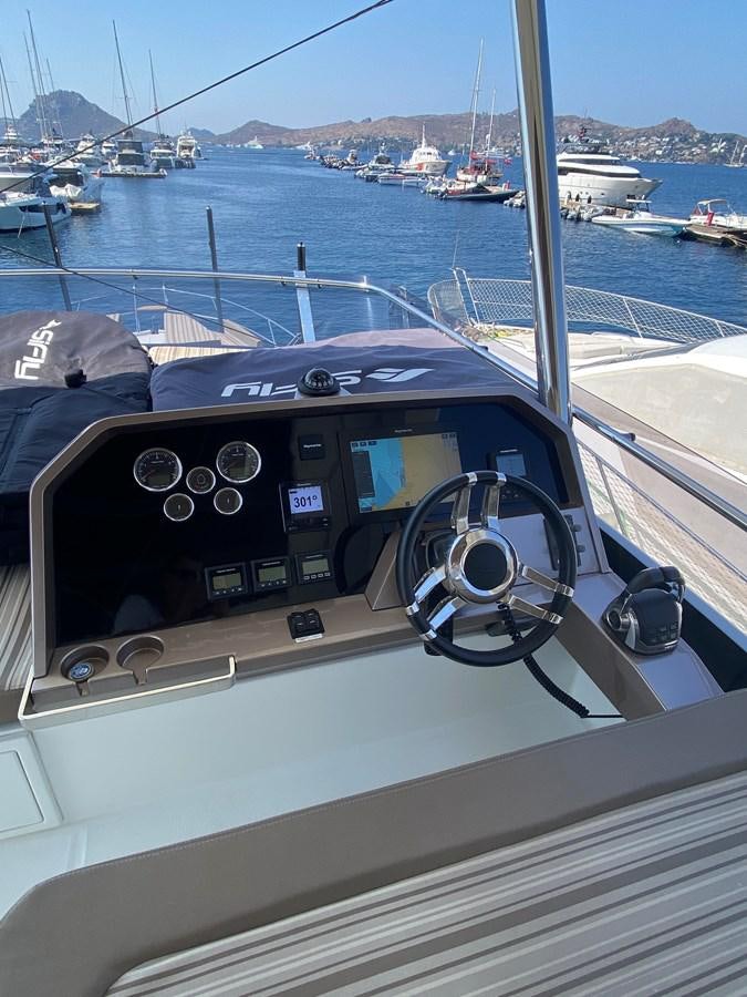 a boat with a steering wheel aboard GALEON 640 Yacht for Sale