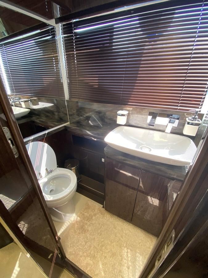 a bathroom with a sink and a toilet aboard GALEON 640 Yacht for Sale