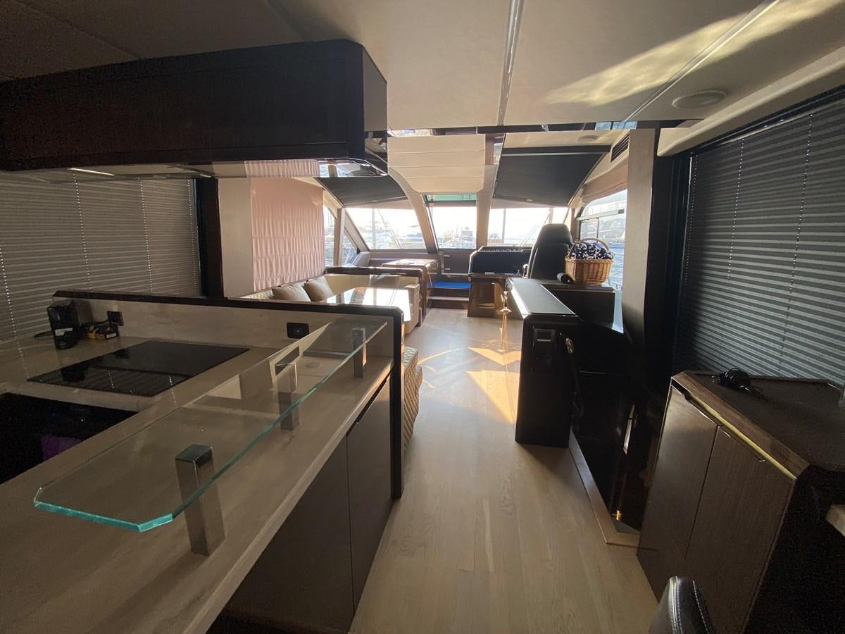 a room with a large table and chairs aboard GALEON 640 Yacht for Sale