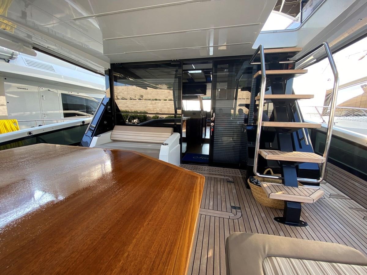 a room with a ladder and a bench aboard GALEON 640 Yacht for Sale
