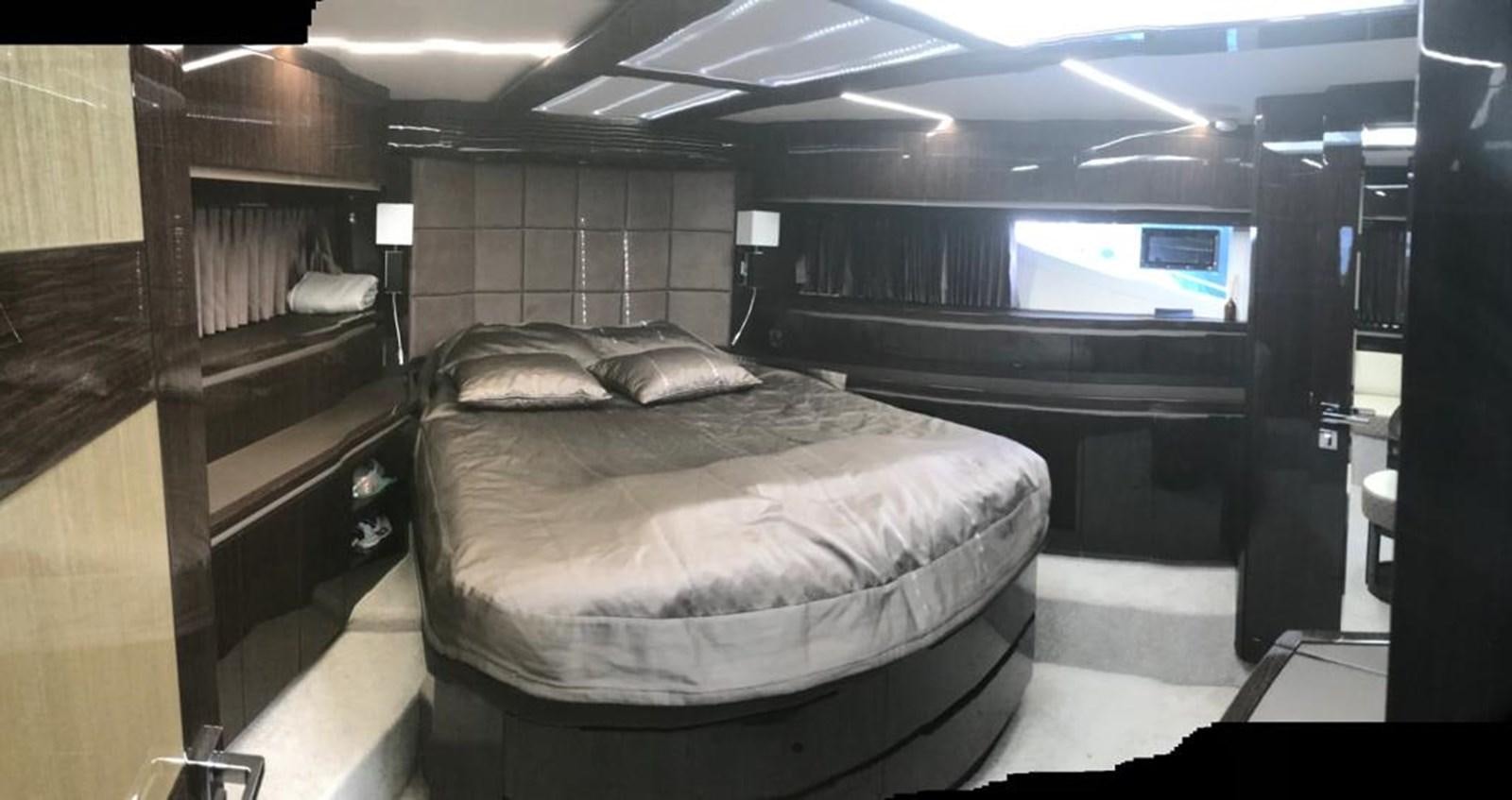 a room with a bed and a tv aboard GALEON 640 Yacht for Sale