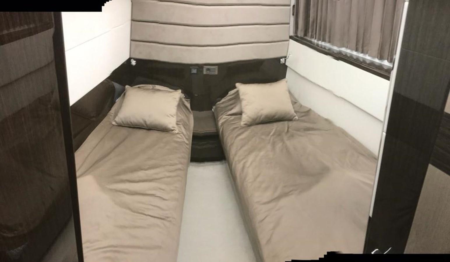 a bed with white sheets aboard GALEON 640 Yacht for Sale