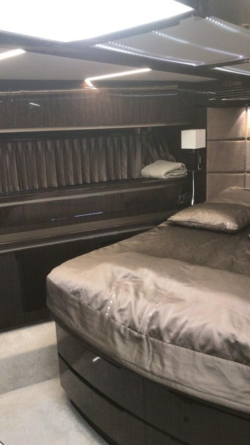 a room with a bed and a lamp aboard GALEON 640 Yacht for Sale