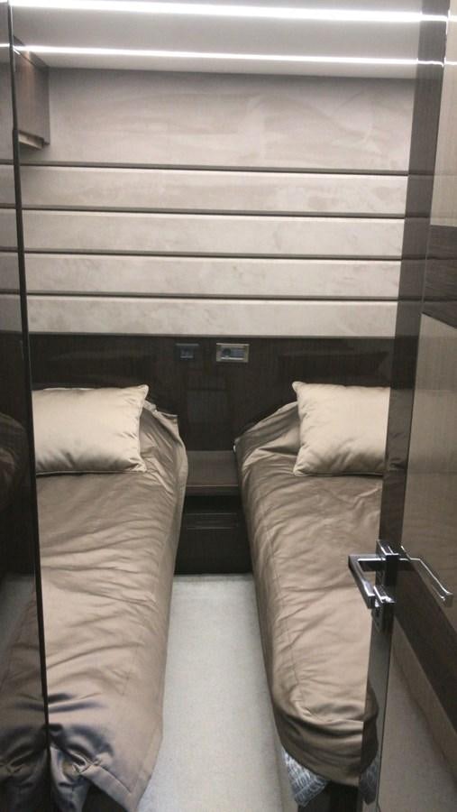 a bed with a wooden frame aboard GALEON 640 Yacht for Sale