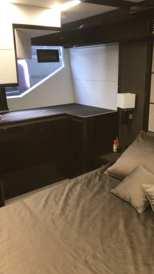 a bed with a mirror above it aboard GALEON 640 Yacht for Sale