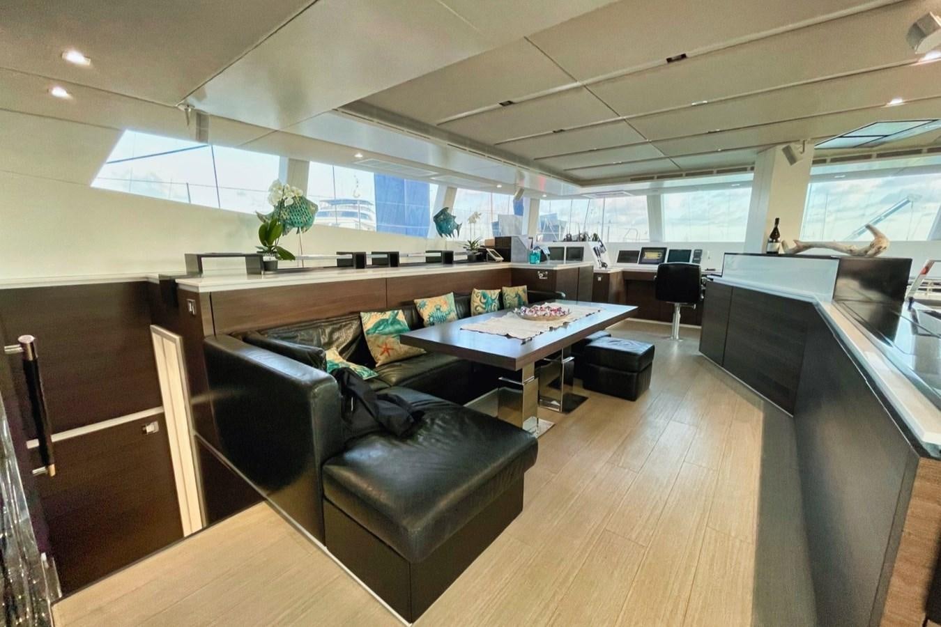 a room with a table and chairs aboard ALKIMIA Yacht for Sale
